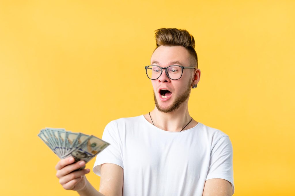 Young man excited to earn money